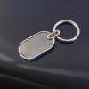 02_86a3f76b-2dac-4478-8215-2f5c29aaa4a0.jpg Elegant Black & Silver Oval Metal Keychain (1 Pc)