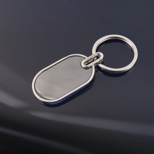 02_86a3f76b-2dac-4478-8215-2f5c29aaa4a0.jpg Elegant Black & Silver Oval Metal Keychain (1 Pc)