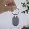 03_35260e64-74cb-4f1d-aecd-09c7ae14d613.jpg Elegant Black & Silver Oval Metal Keychain (1 Pc)