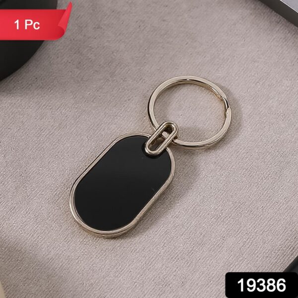 WhatsAppImage2025-06-24at18.39.27.jpg Elegant Black & Silver Oval Metal Keychain (1 Pc)