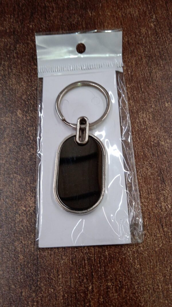 dadcbe02-ee5d-40ea-b15e-9ab9b67b4851.jpg Elegant Black & Silver Oval Metal Keychain (1 Pc)